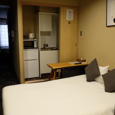 Hôtel Shiki Suites (Kyoto), chambre avec kitchenette et canapé convertible