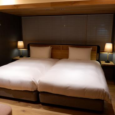 Good Nature Hotel (Kyoto), coin literie de la chambre Superior Twin